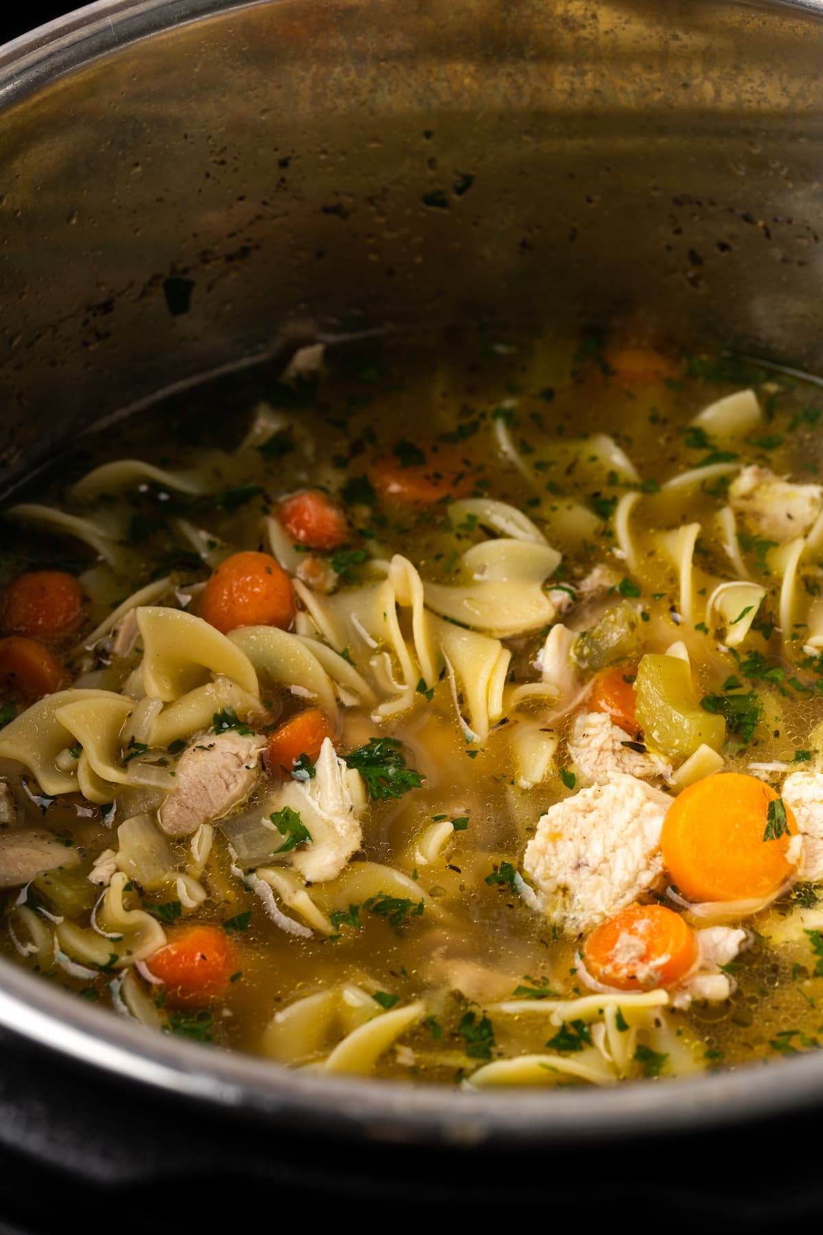 Close up of chicken noodle soup inside the Instant Pot.