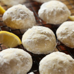 Sunshine Lemon Cooler Cookies on a cooling rack with lemon slices