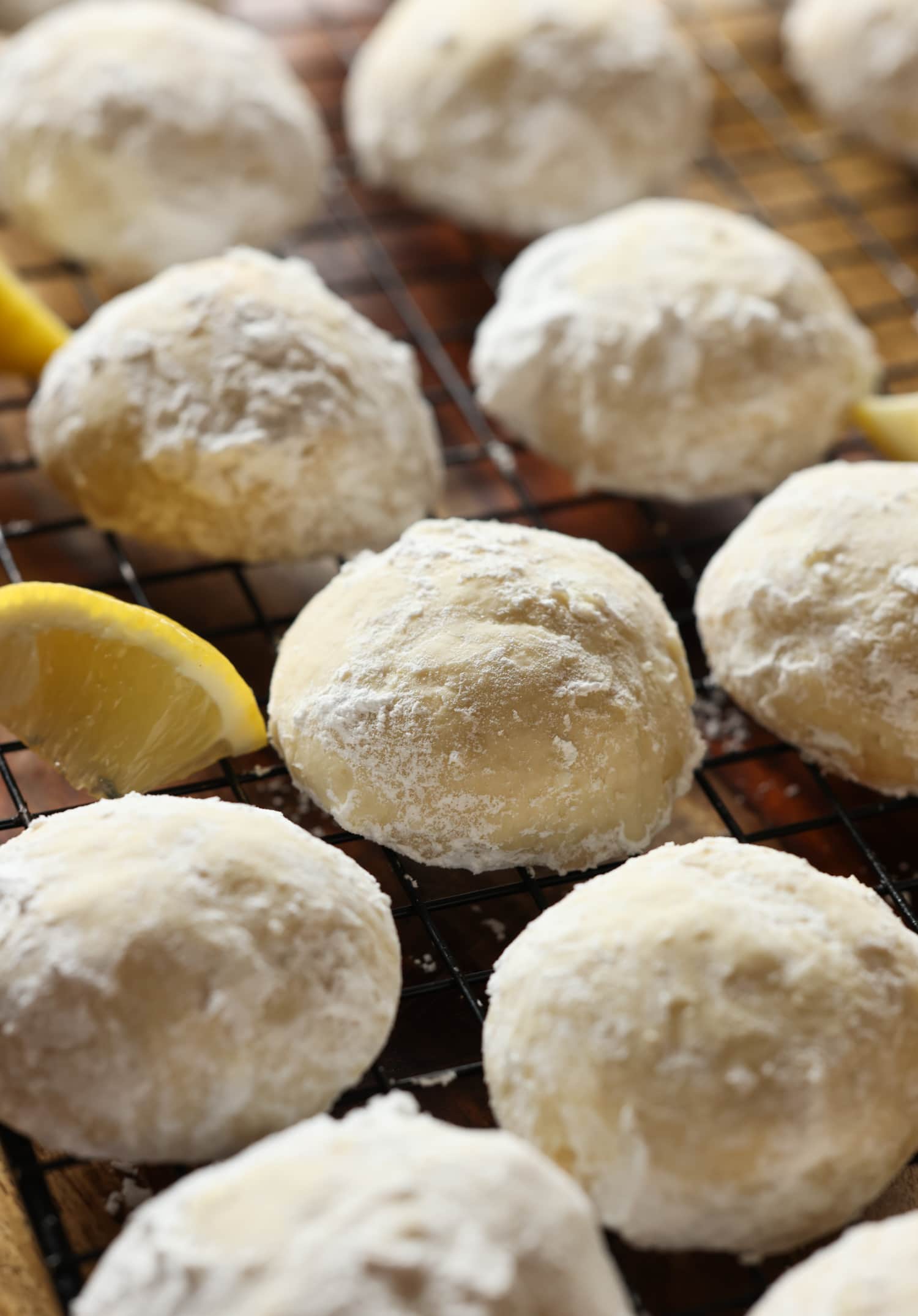 Cooling Rack of Sunshine Lemon Cooler Cookies and Lemon Slices