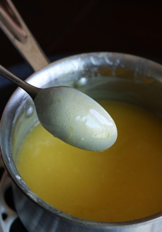 lemon curd sticking to the back of a spoon