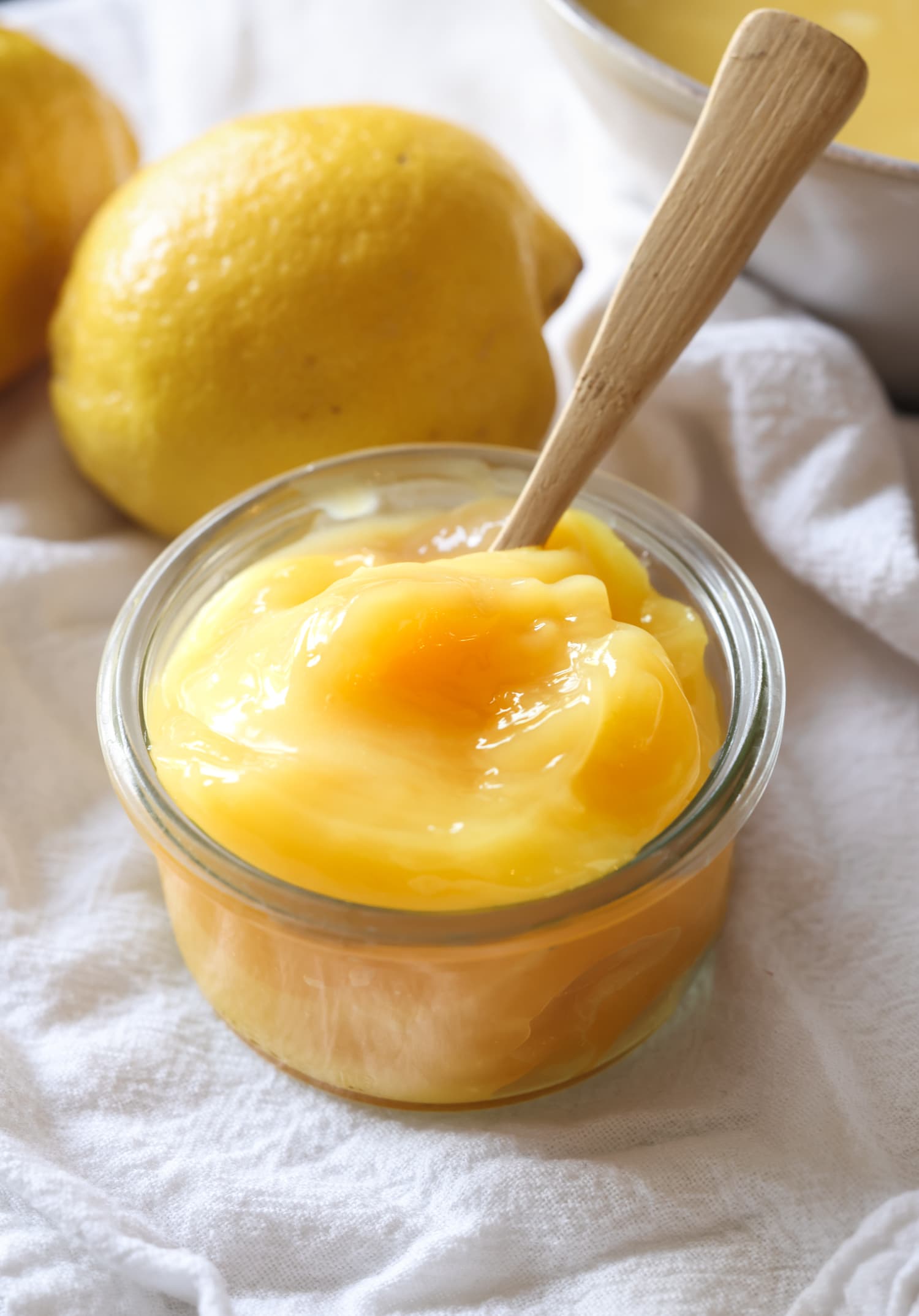 Chilled homemade lemon curd in a glass jar