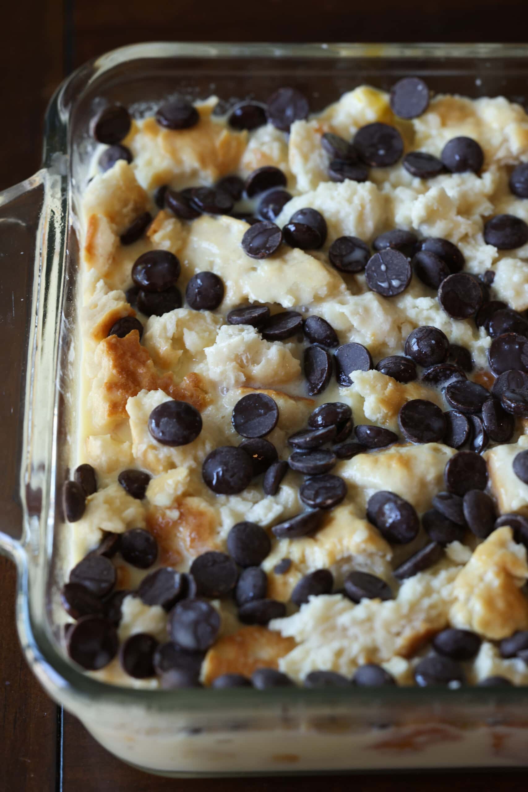 This cookie bread pudding recipe is a twist on the classic bread pudding. It's soothing, rich and delicious. You can use up leftover cookies in this easy dessert recipe. Day-old cookies, torn into pieces, soaked in an egg custard mixture and topped with chocolate chips before going into the oven to bake.