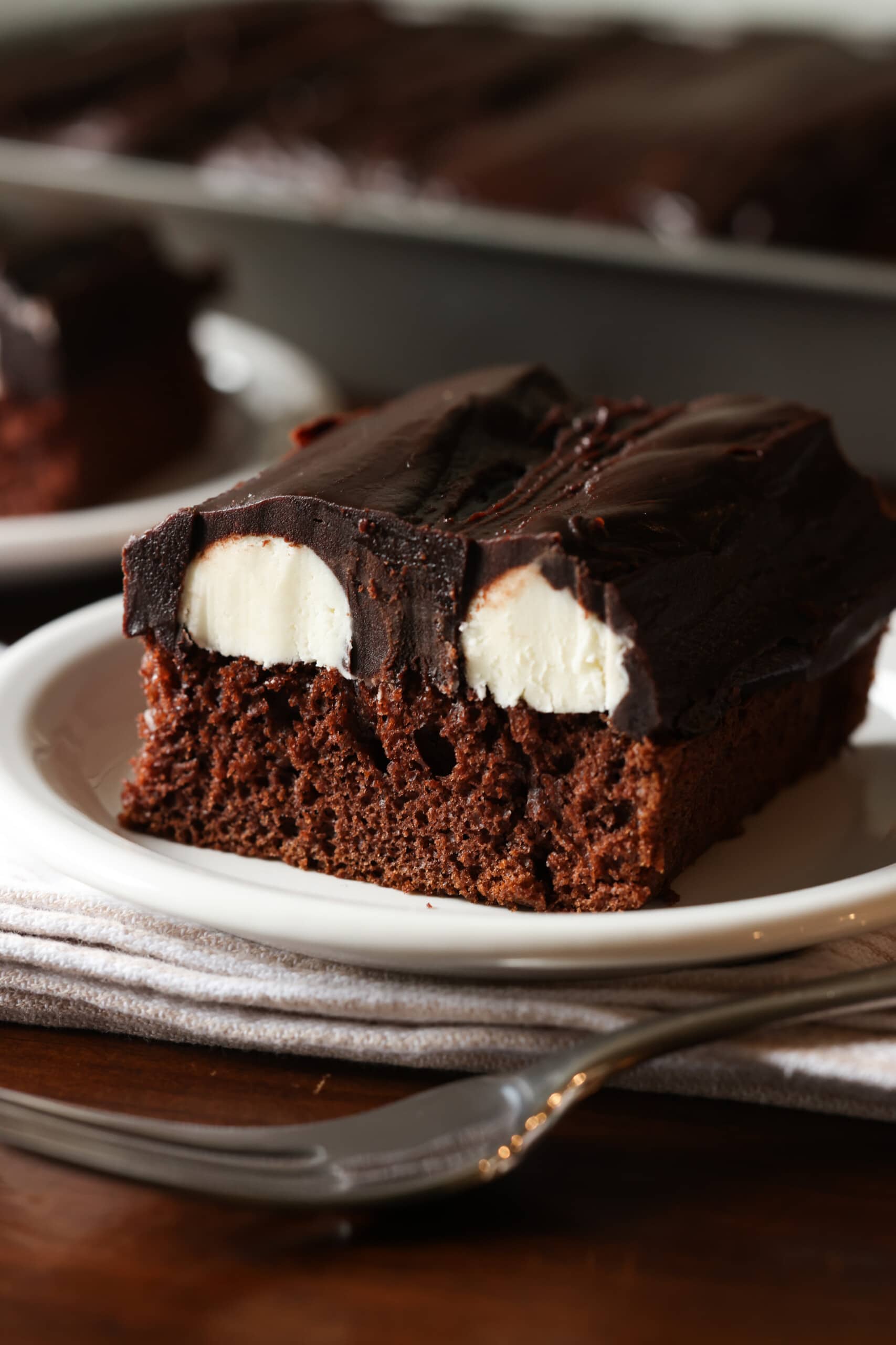 Slice of bumpy cake on white plate