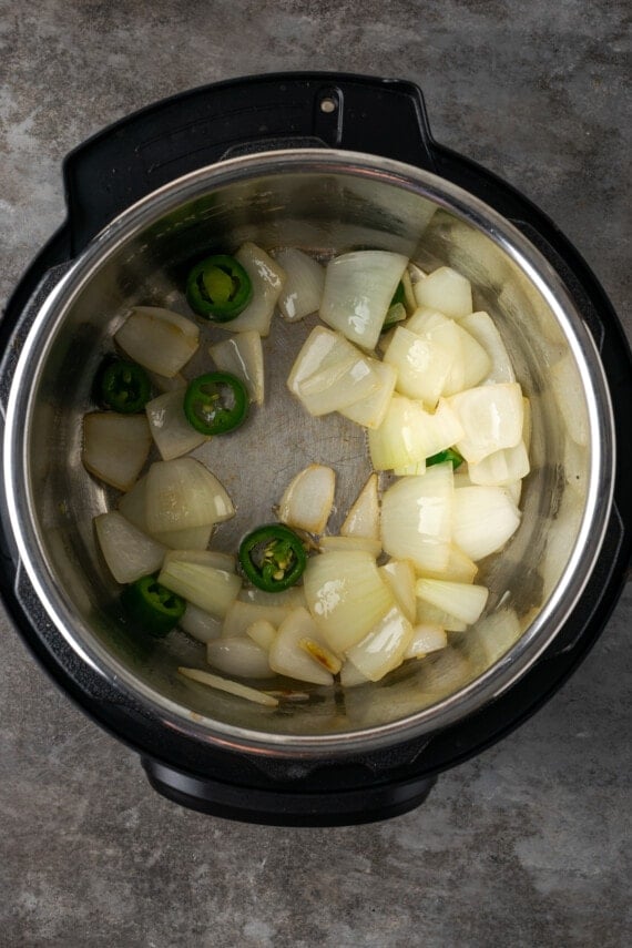 Chopped onions and jalapeños sauted inside the instant pot.