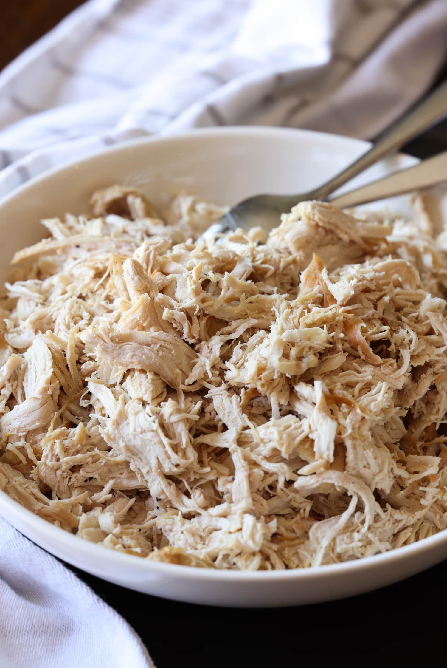 cooked and shredded chicken in a bowl