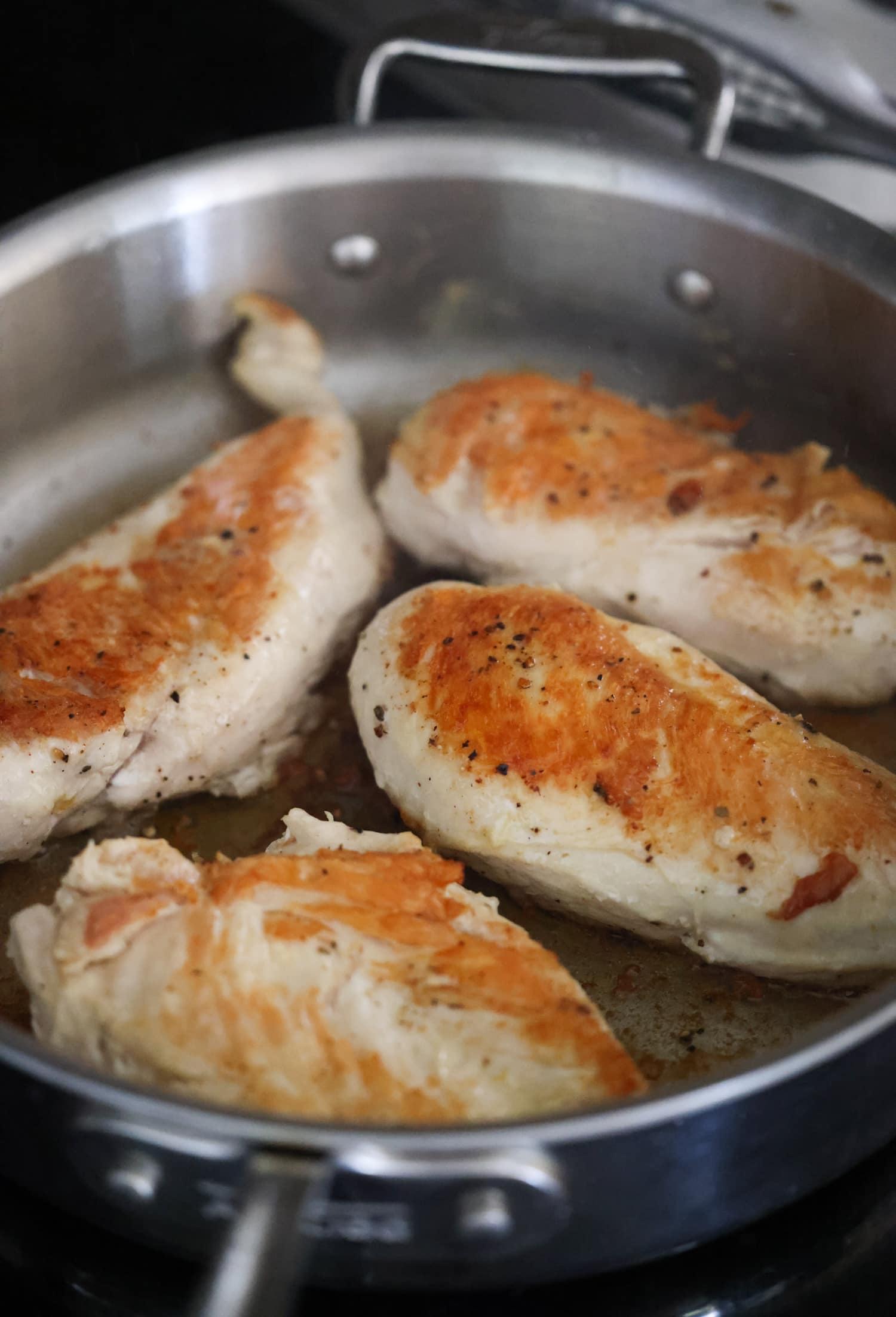 browned chicken in a skillet