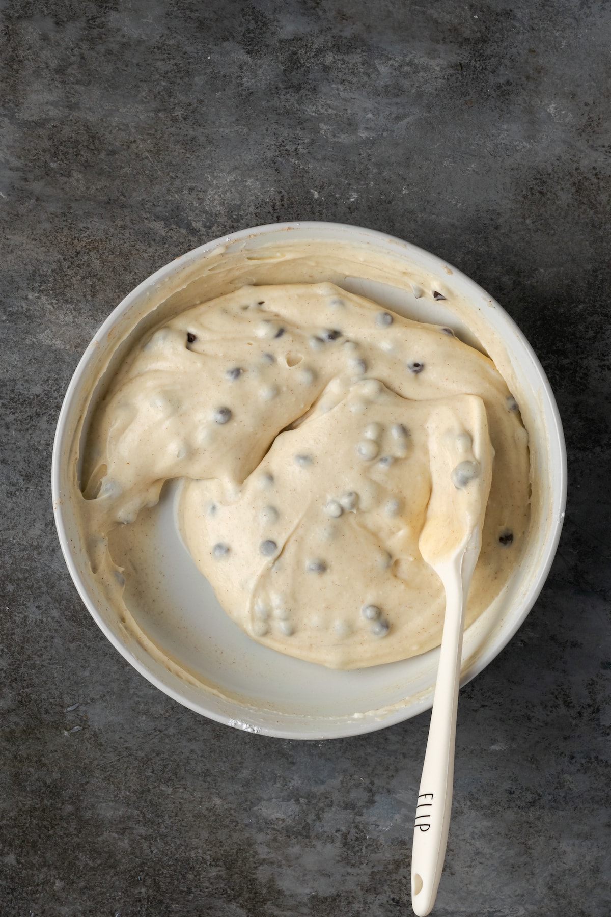 Cannoli topping in a bowl with a spatula.