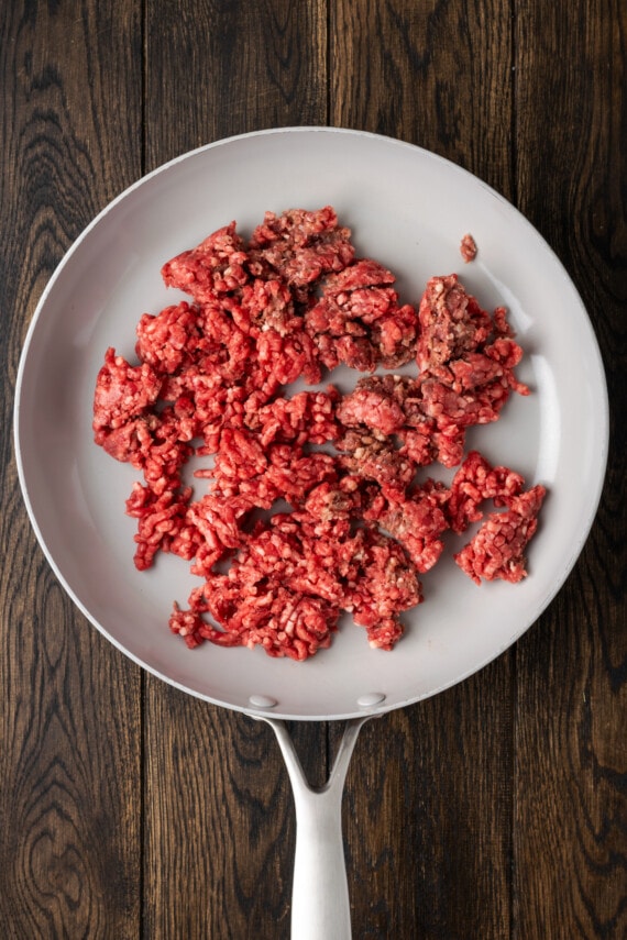 Ground beef in a skillet.