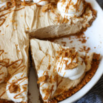 Cookie Butter Pie with a slice cut in a pie plate from above