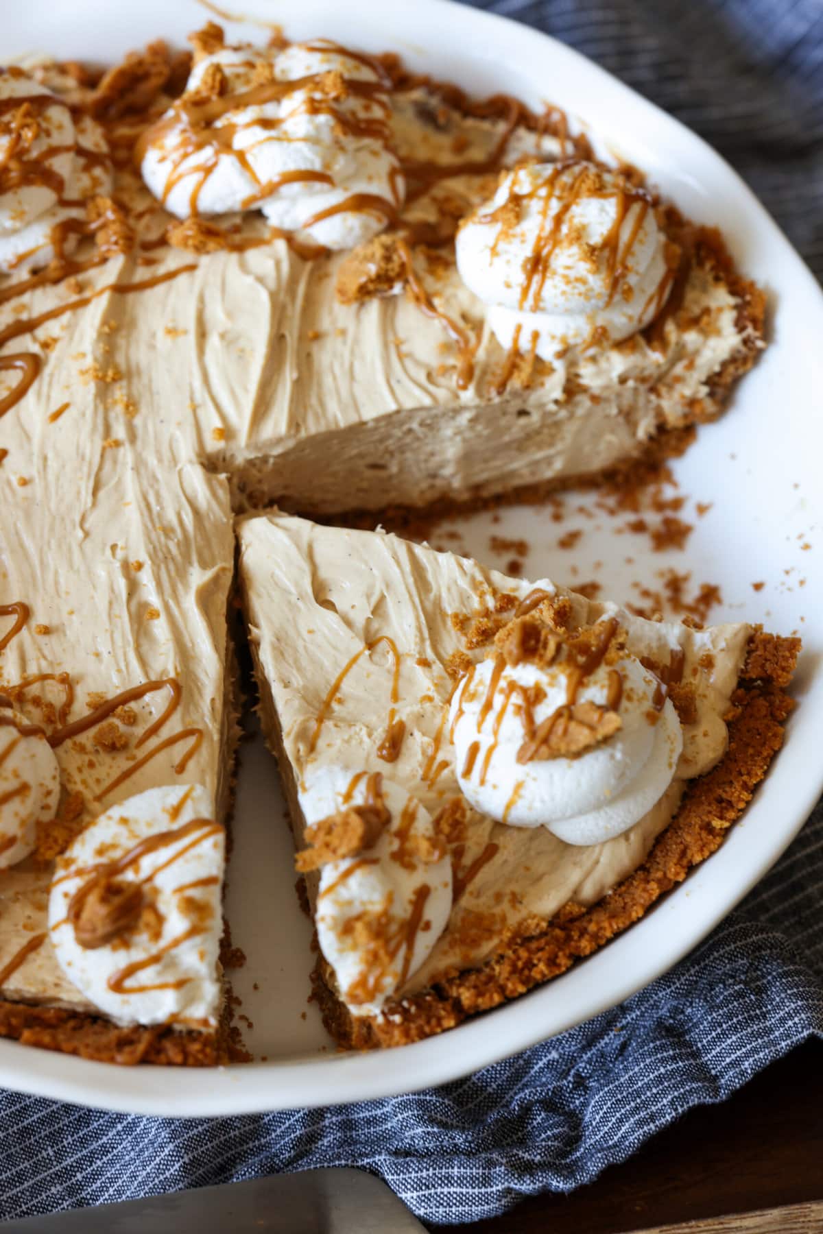 Cookie Butter Pie with a slice cut in a pie plate from above