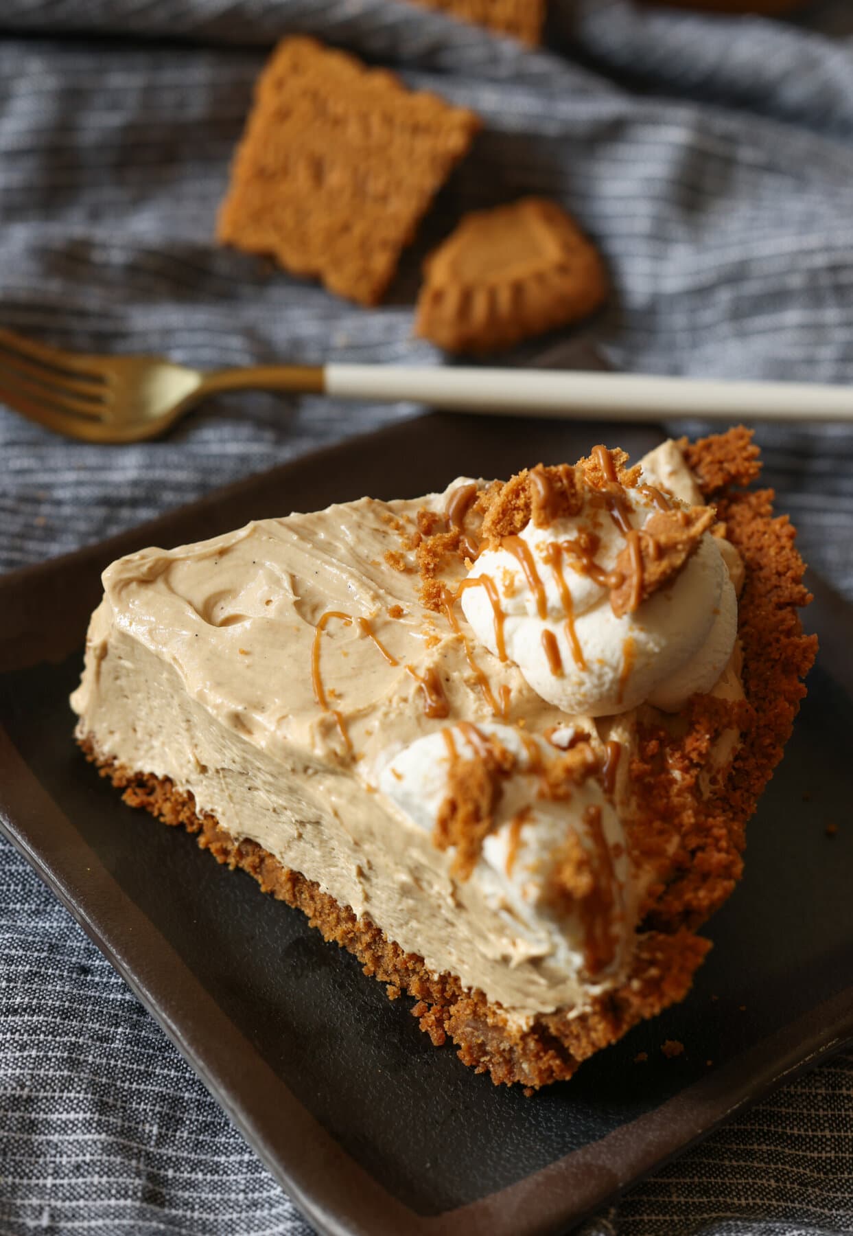 Cookie Butter Pie on a plate with whipped cream