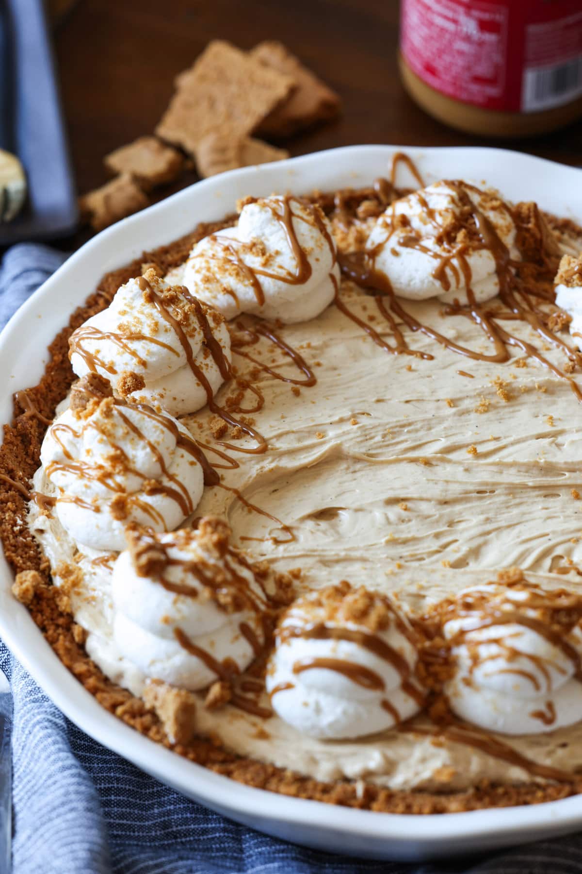 Cookie Butter Pie in a pie dish whipped with whipped cream