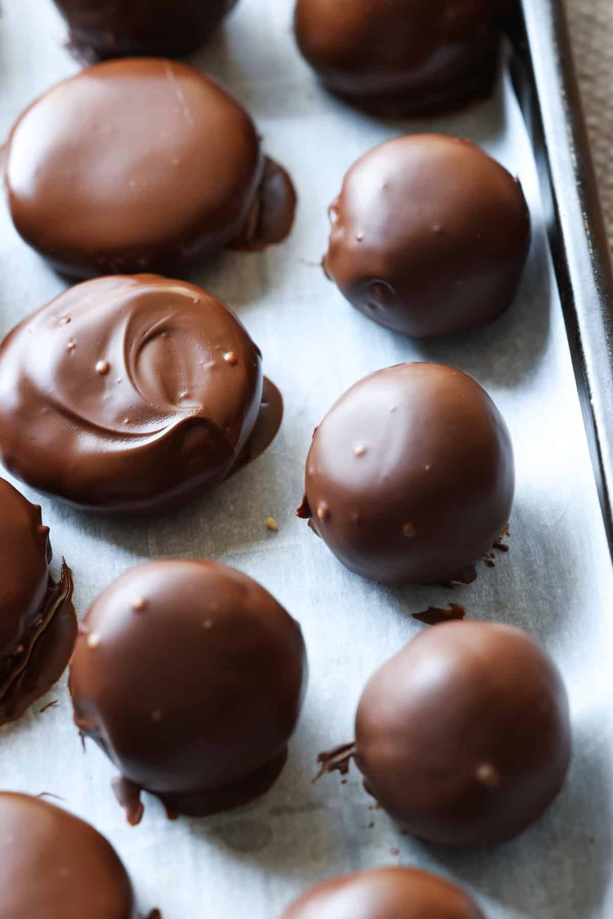 Chocolate set on a peanut butter truffle after being coated.