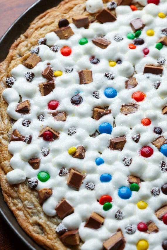 A large cookie pizza baked on a nonstick pizza pan with melted marshmallows for "cheese" and candy toppings