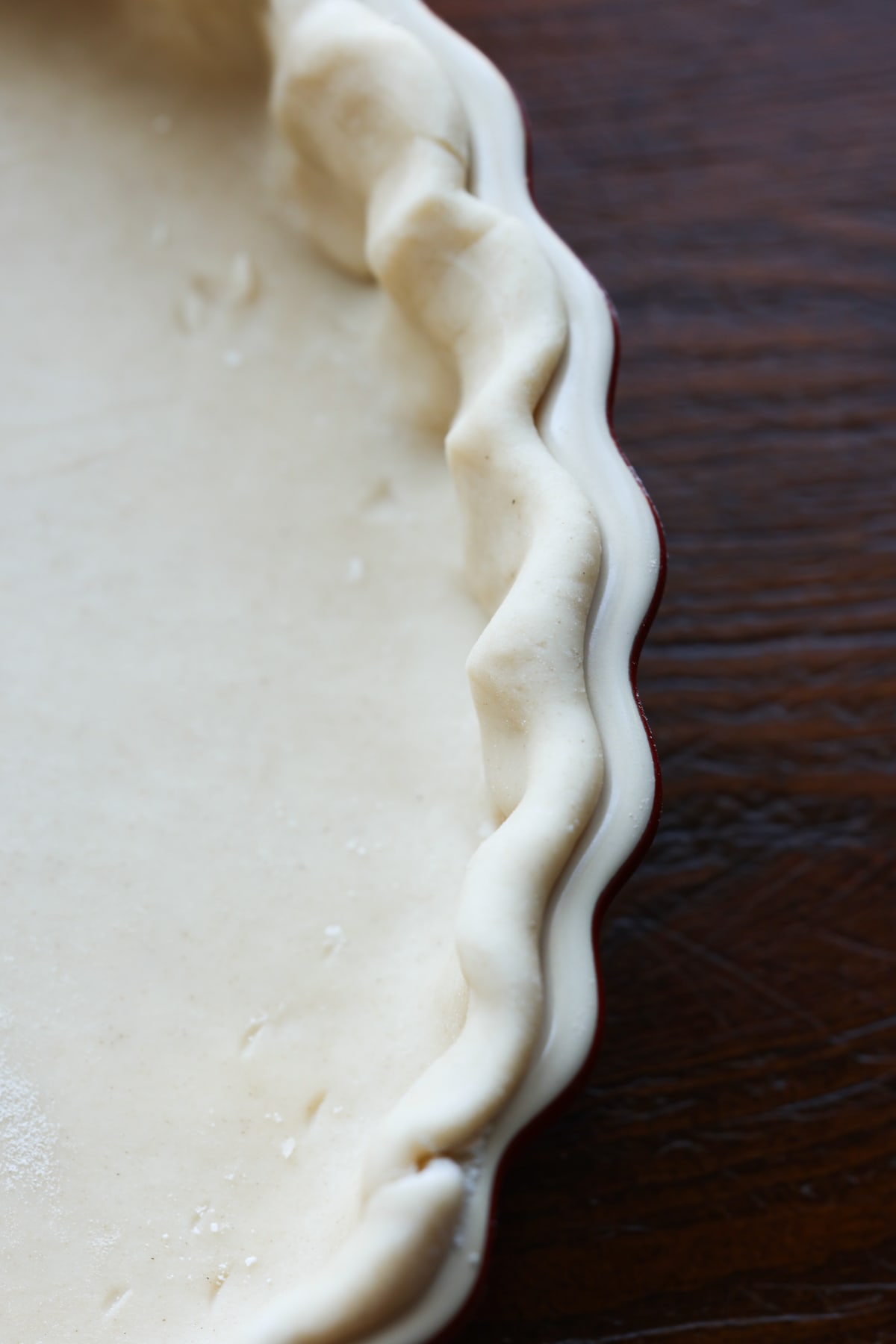 pie dough in a tart pan fluted at the edge