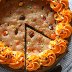 A single slice being served from a cookie cake