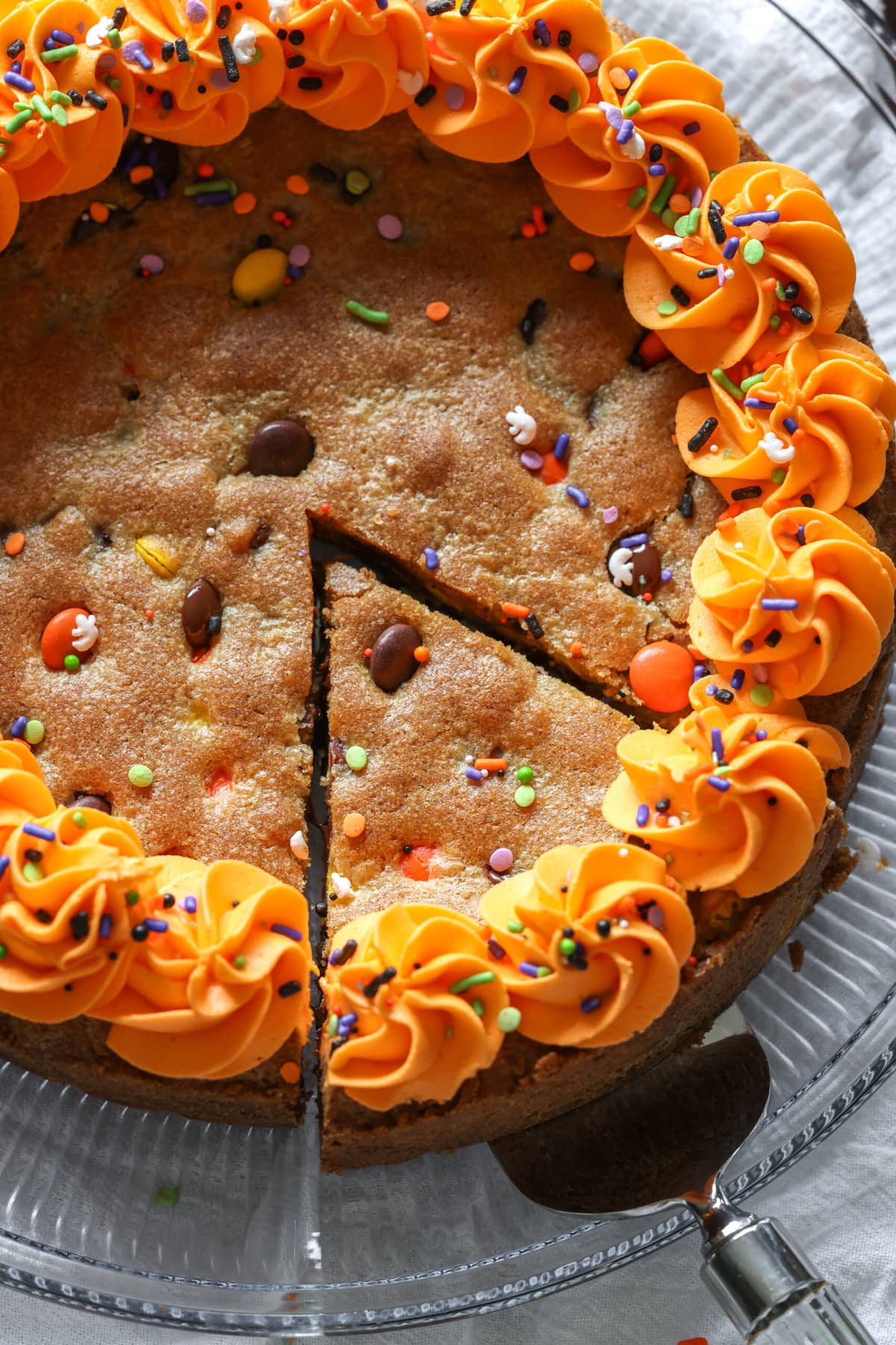 A single slice being served from a cookie cake