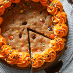 A single slice being served from a cookie cake