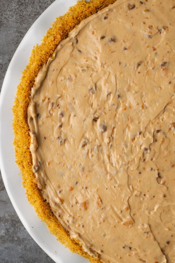 Top view of Butterfinger pie assembled in a white pie dish.