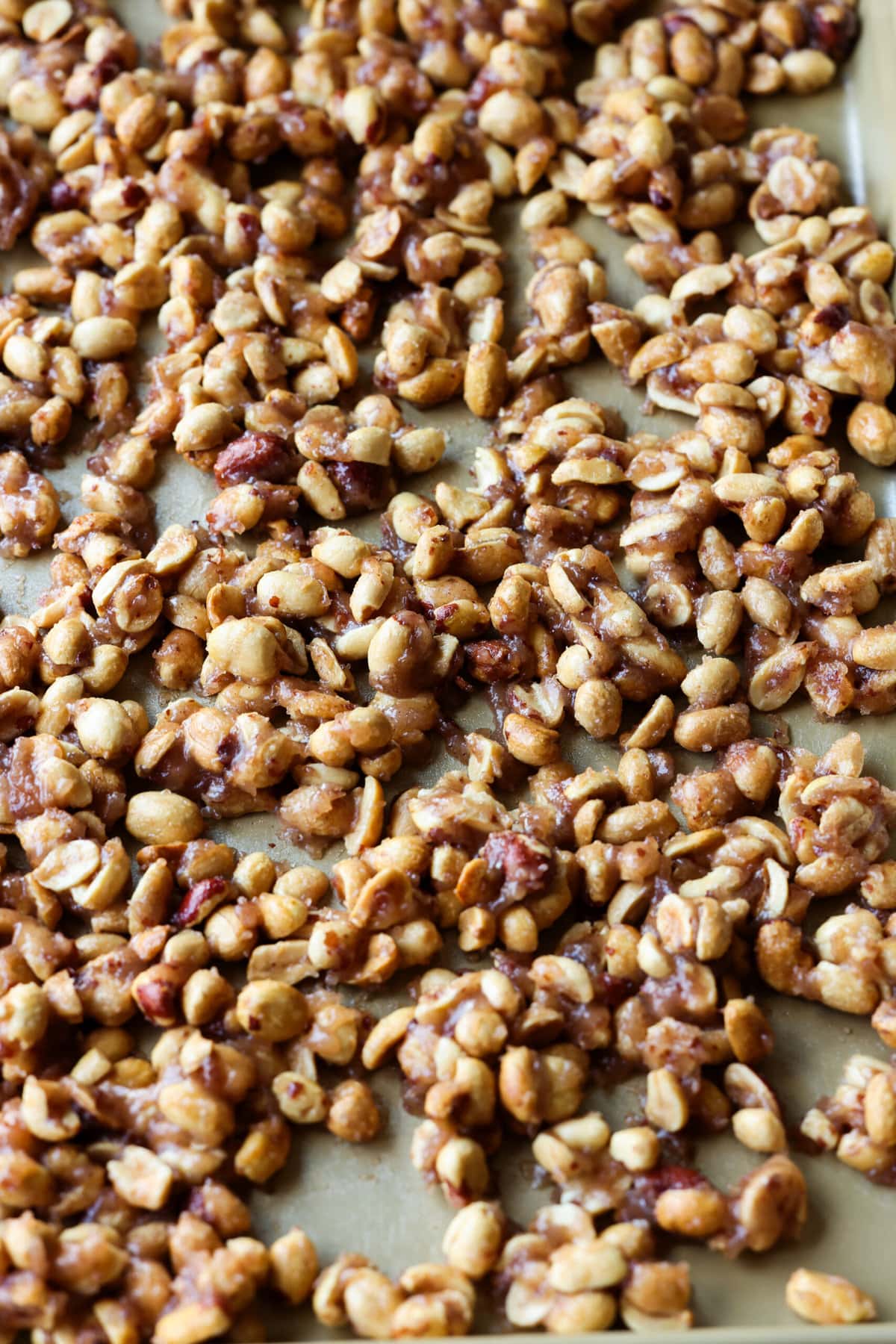Toffee peanuts on a baking sheet