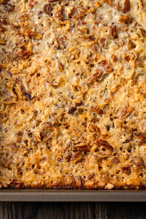 Close up overhead view of magic bars in a baking pan.