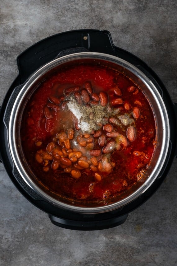 Salt and pepper added to finished chili inside the instant pot.