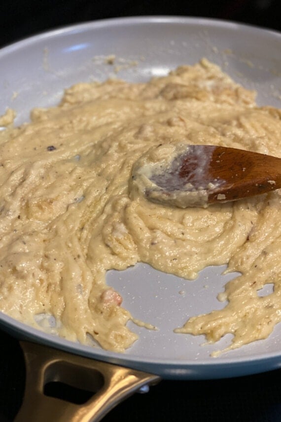 Cooking a roux in a skillet with a wooden spoon