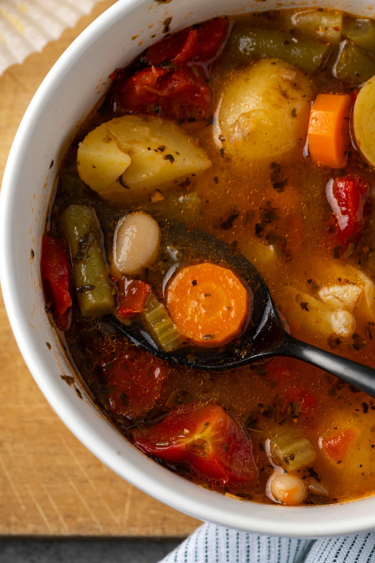 Close up overhead view of a bowl of vegetable soup.