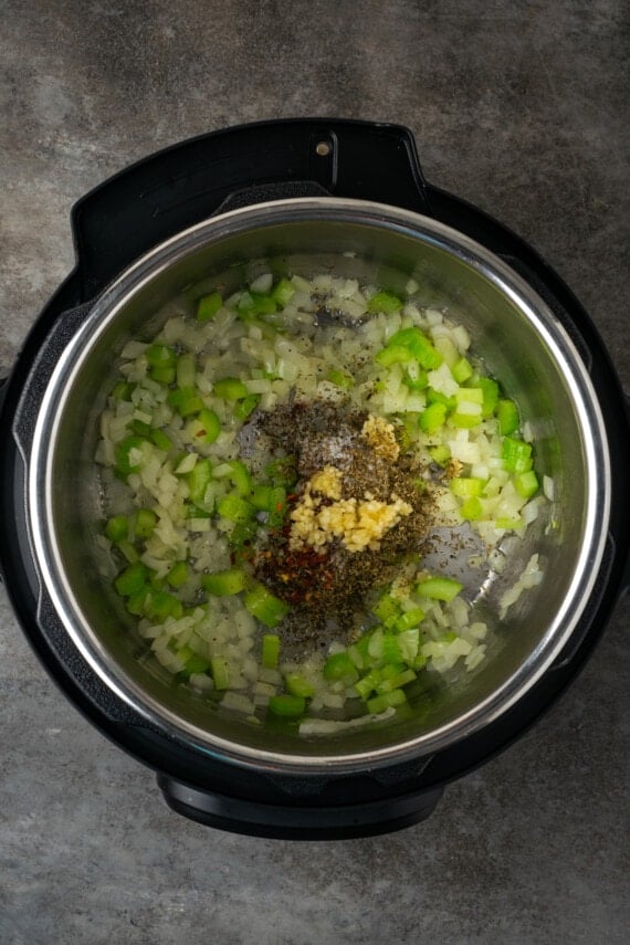 Seasonings added to sauteed celery and onions in the instant pot.