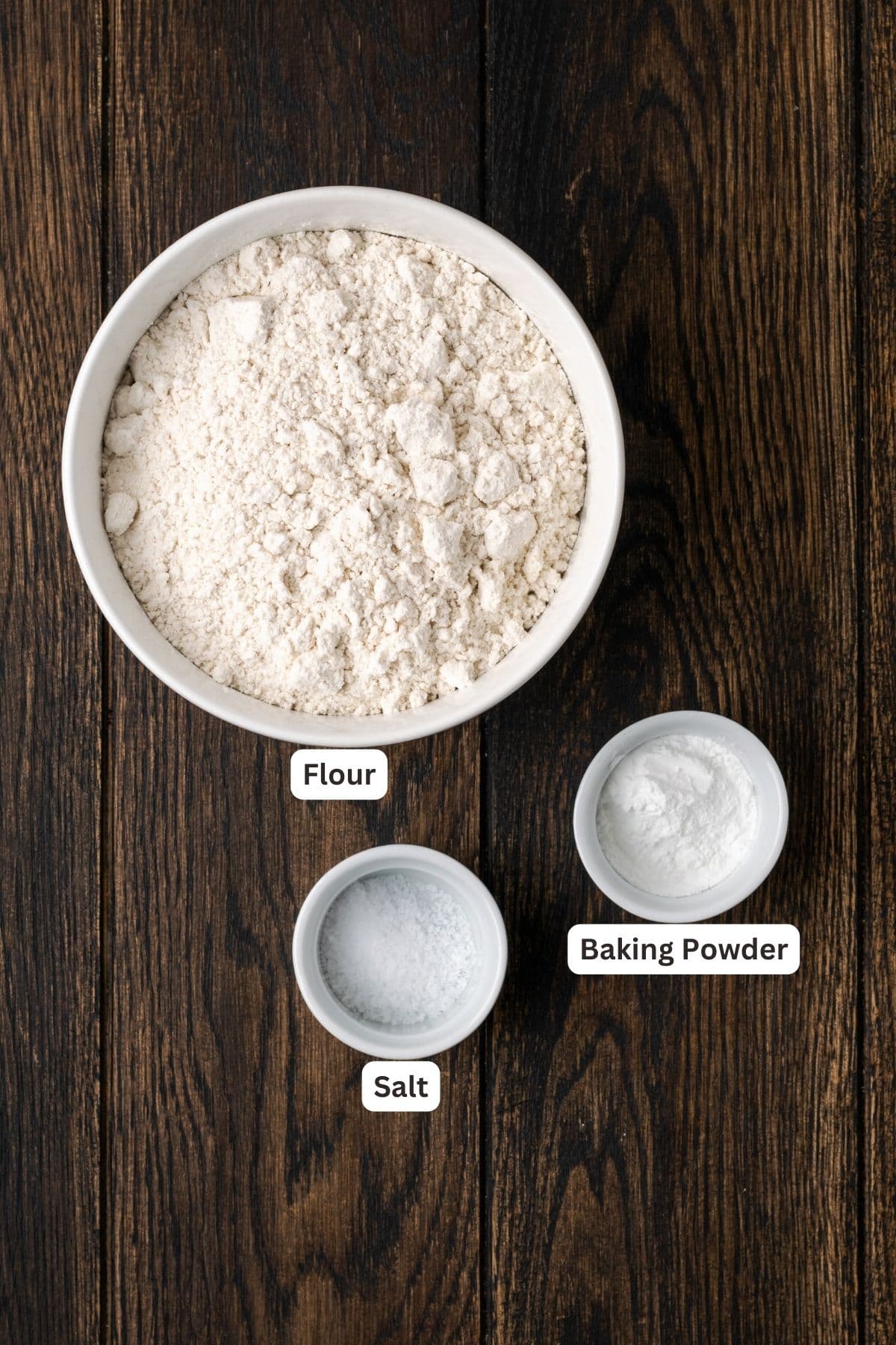 Ingredients for self rising flour with text labels overlaying each ingredient.