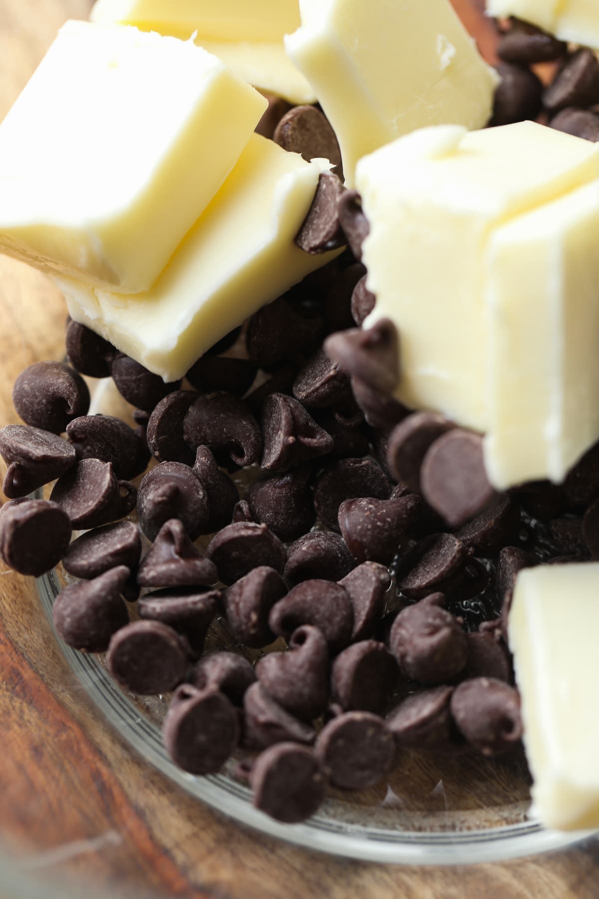 sliced butter and chocolate chips in a glass bowl.