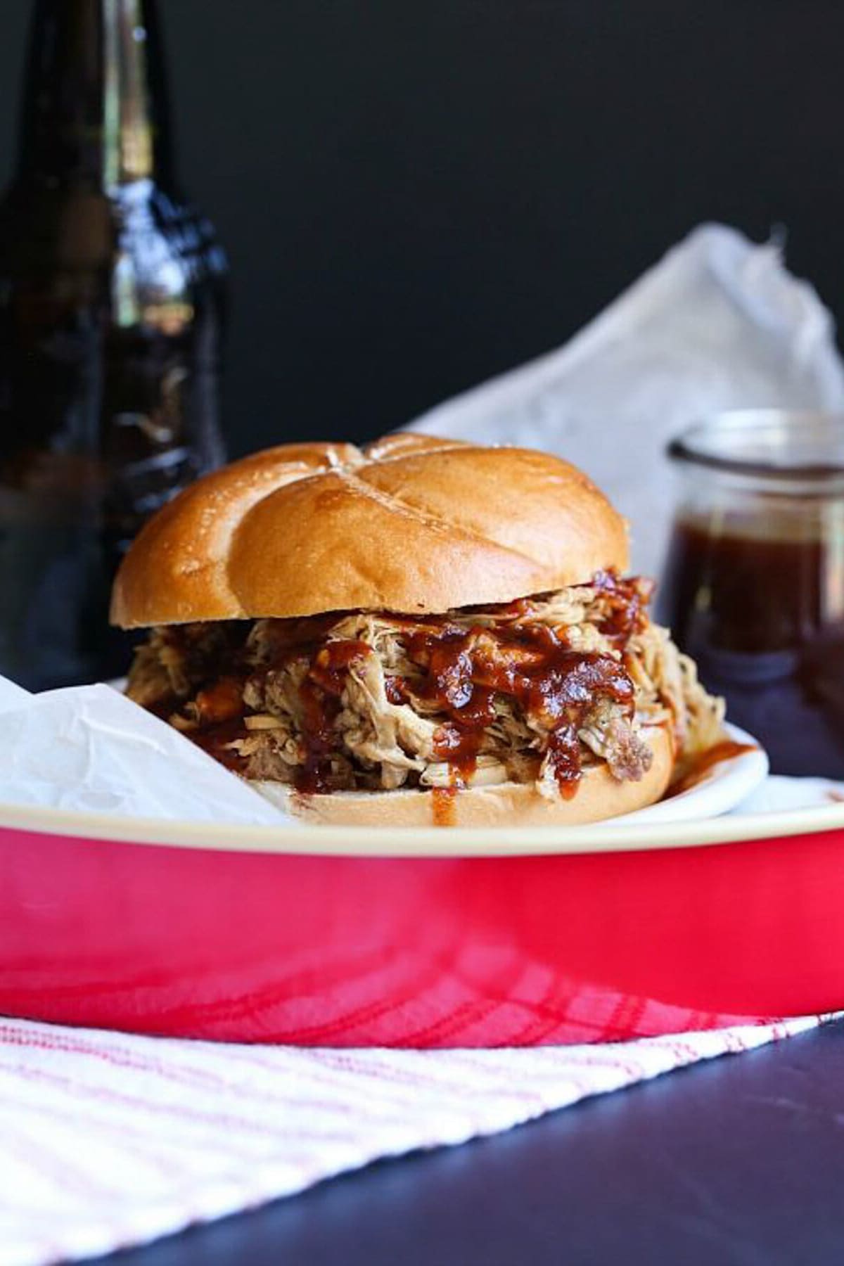 Root Beer Pulled Pork served to eat on a sandwich