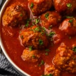 Instant pot meatballs served in a bowl with pasta sauce.