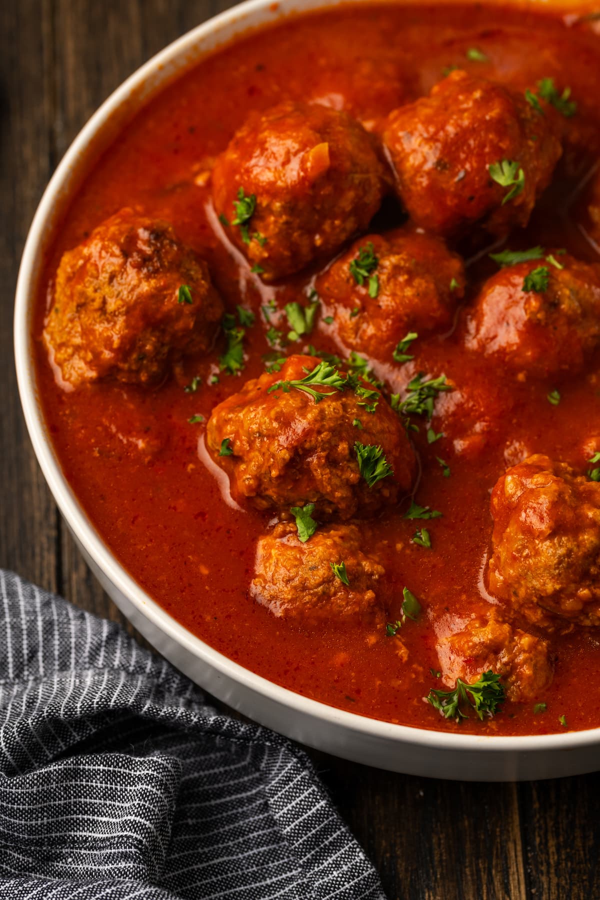 Instant pot meatballs served in a bowl with pasta sauce.