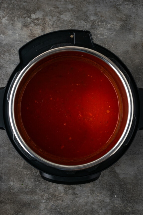 Pasta sauce in the bottom of an instant pot.