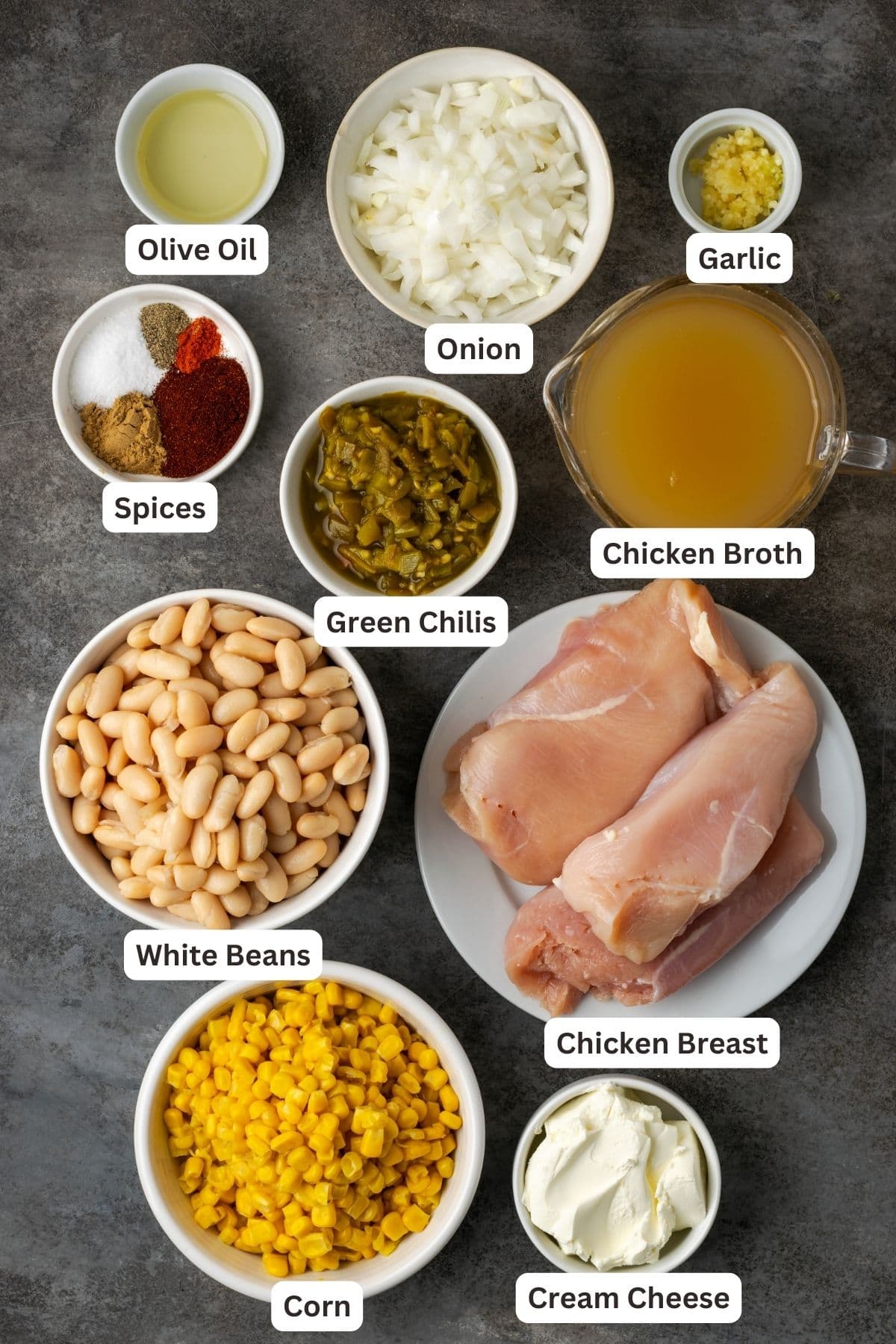 Ingredients for instant pot white chicken chili with text labels overlaying each ingredient.