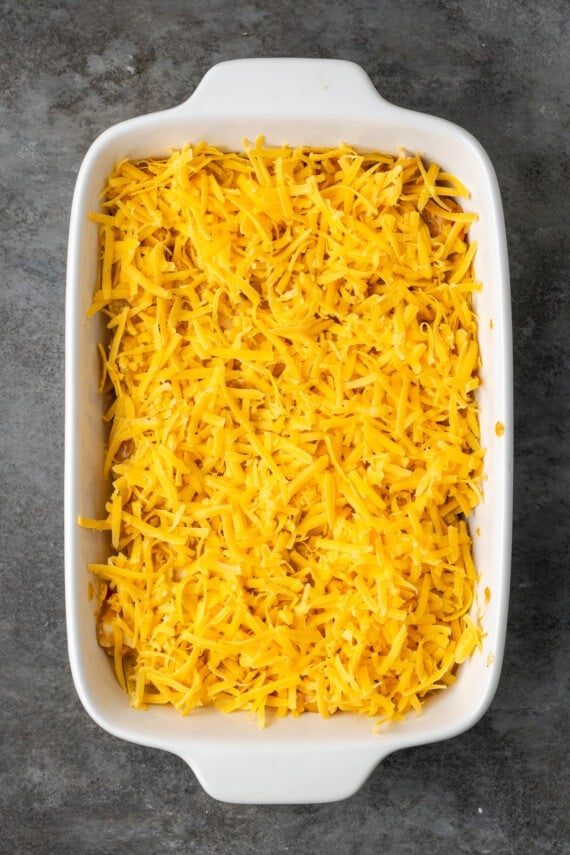 King Ranch chicken casserole topped with shredded cheese.