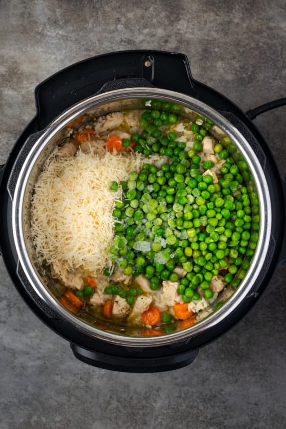 Frozen peas added to cooked chicken and rice in the instant pot.