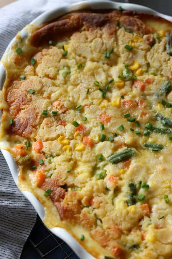 Baked Chicken cobbler casserole in a sound white baking dish