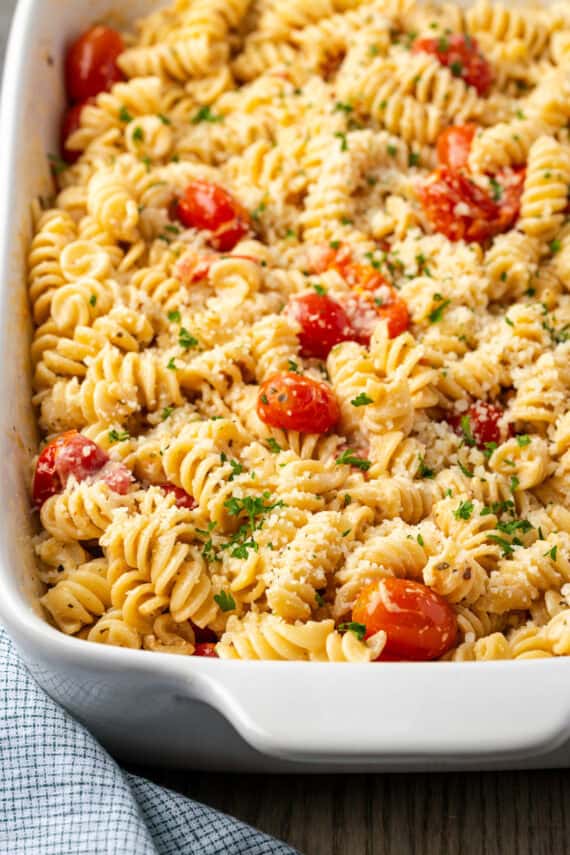 Baked Boursin cheese pasta in a white ceramic casserole dish.