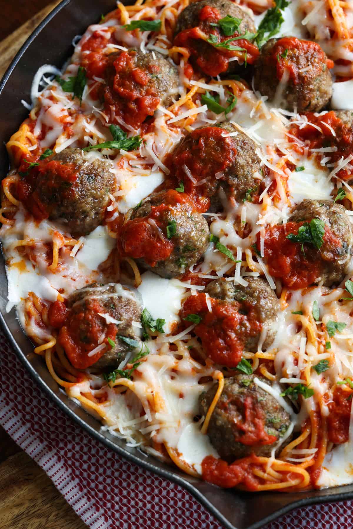 Baked spaghetti and meatballs in a cast iron skillet