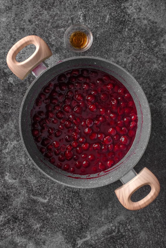 Cherry pie filling in a large pot.