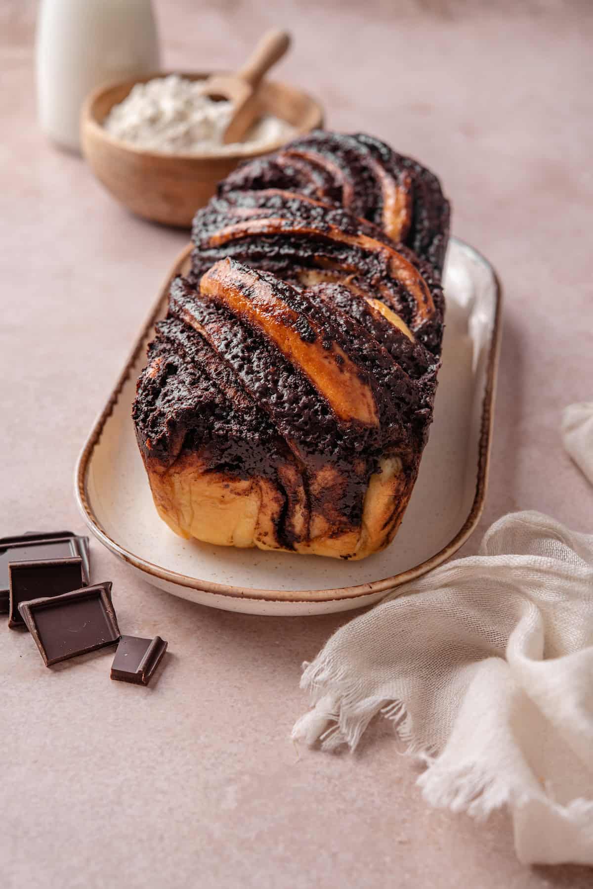 Chocolate babka on a long plate.