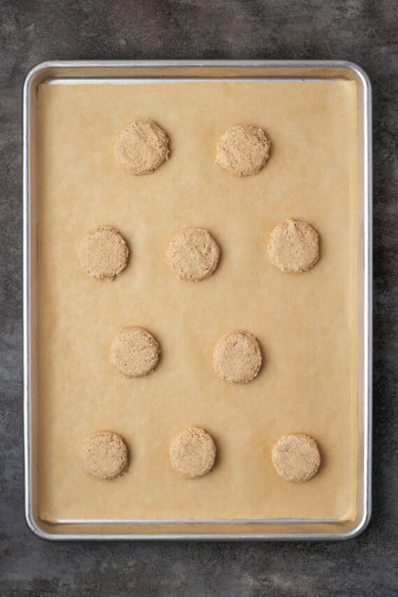 Chai cookie dough portioned out onto a parchment-lined baking sheet.