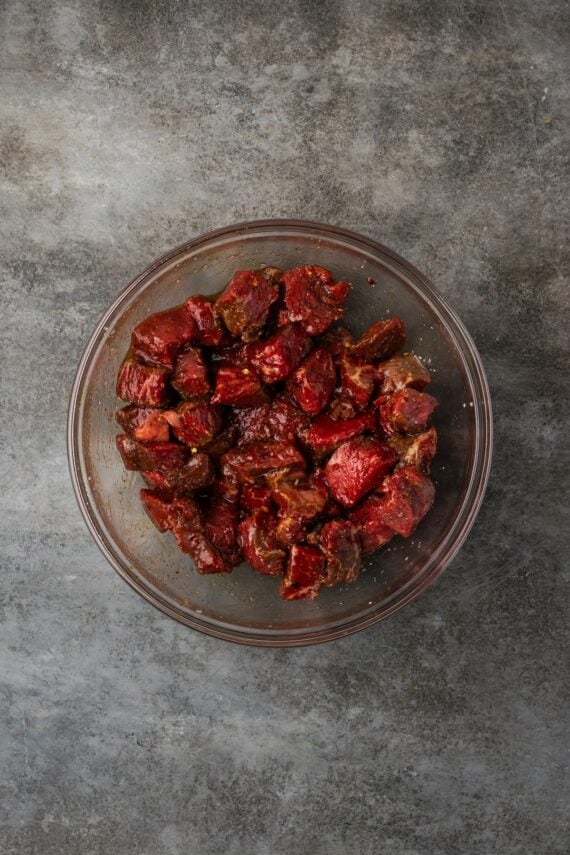 Seasoned steak bites in a bowl.