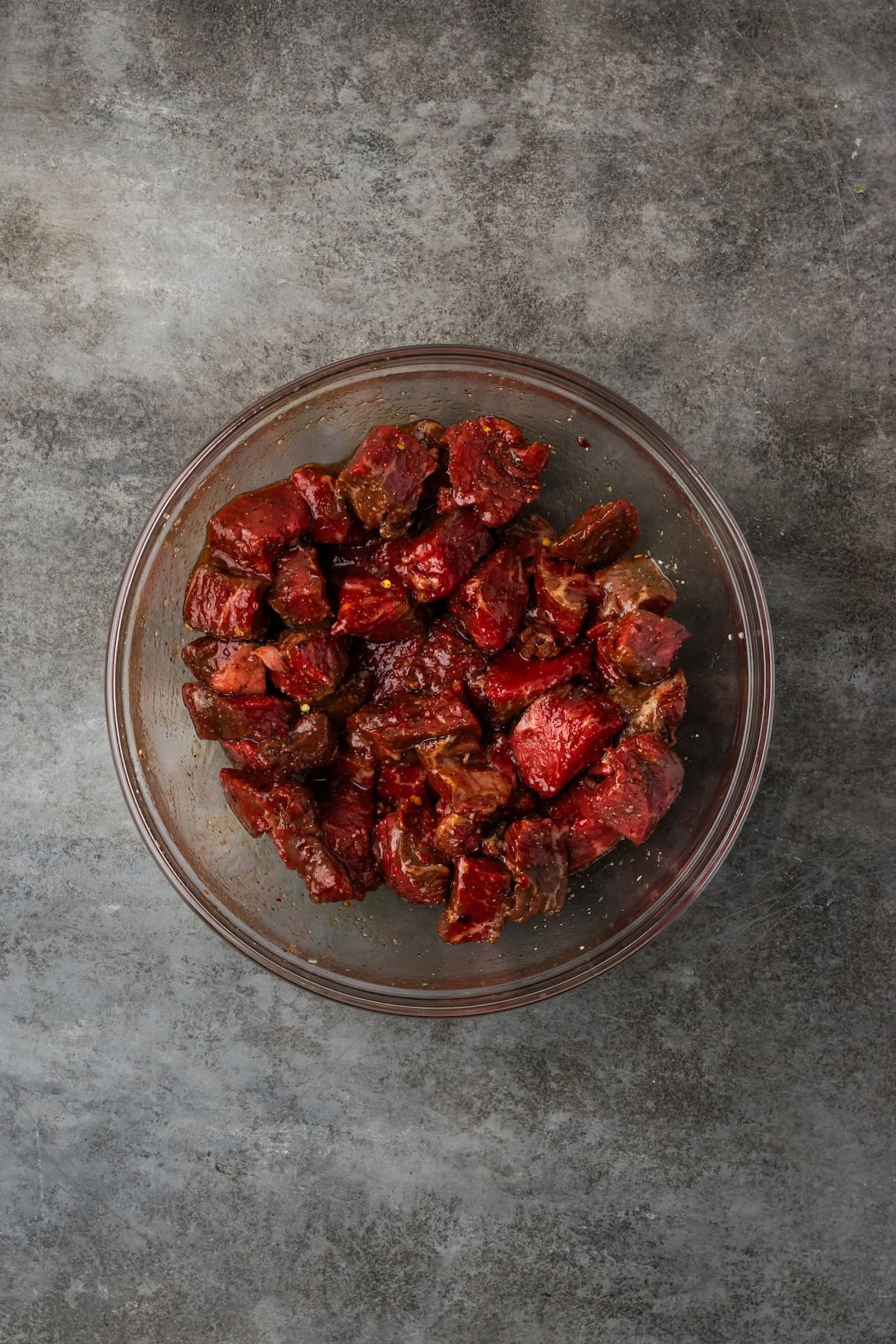 Seasoned steak bites in a bowl.