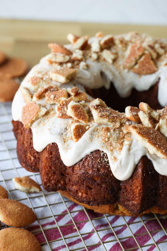 Banana Pudding cake topped with icing and crushed cookies