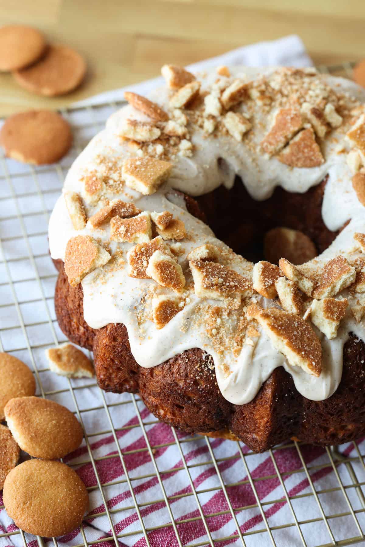 Banana Pudding Cake topped with vanilla icing and crushed Nilla Wafers