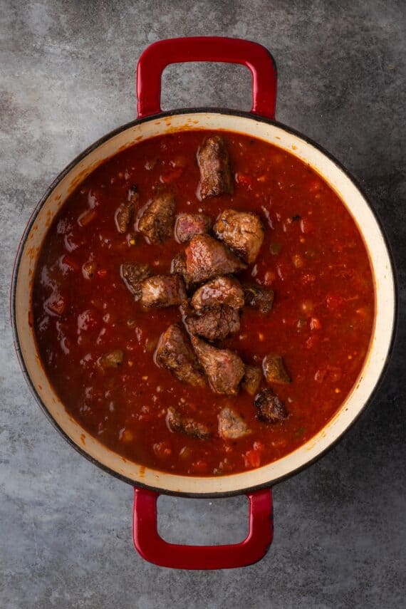 Seared beef added back into the pot with the chili.