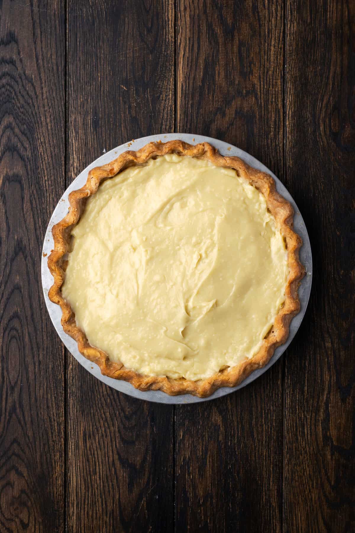Banana cream pie custard added to a pie crust.
